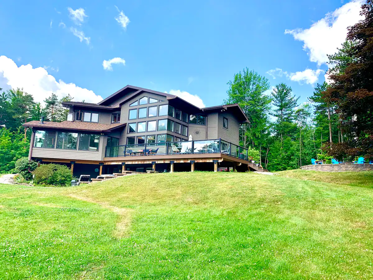 Rear view of Canandaigua Retreat and its lawn