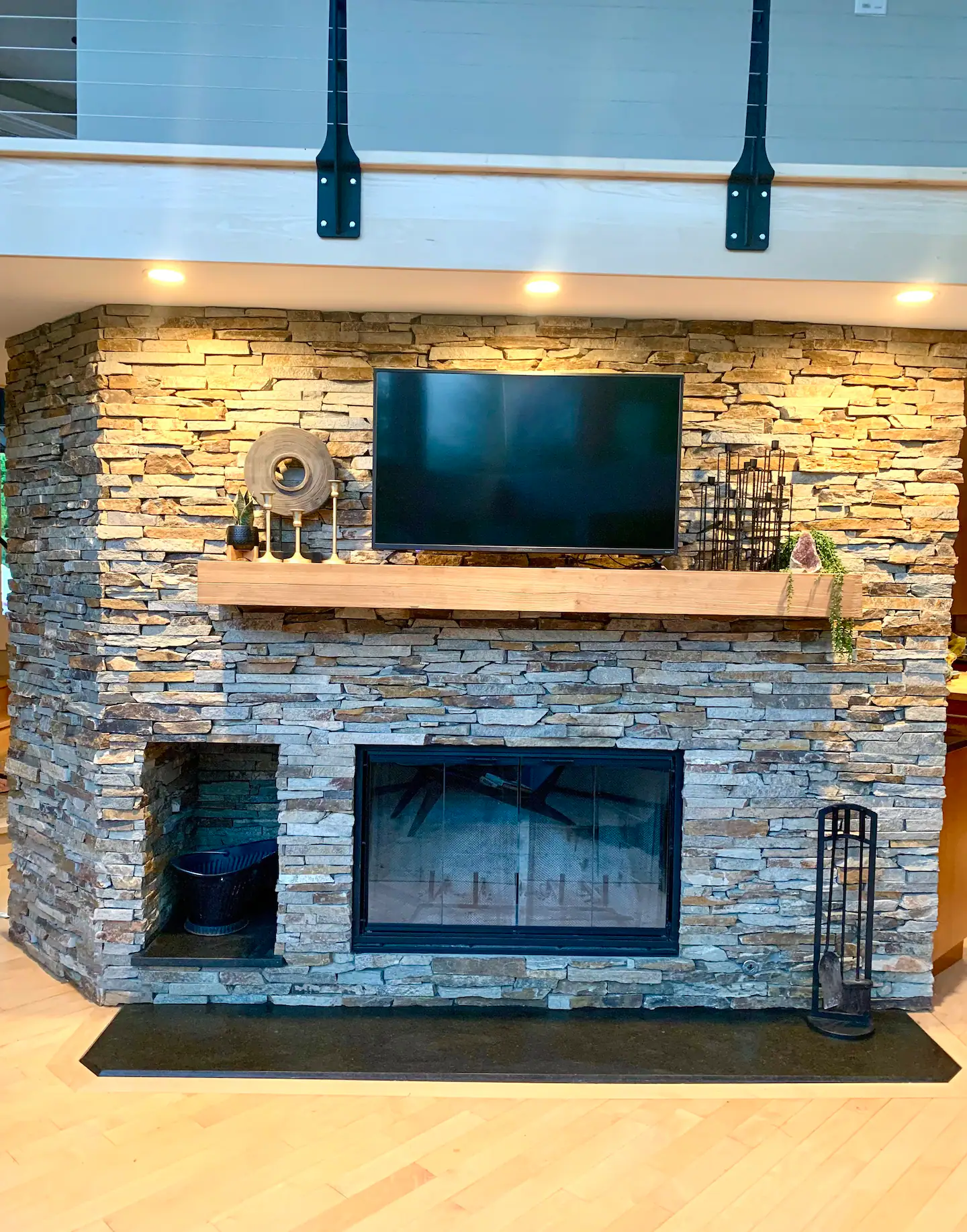 Stone fireplace and television