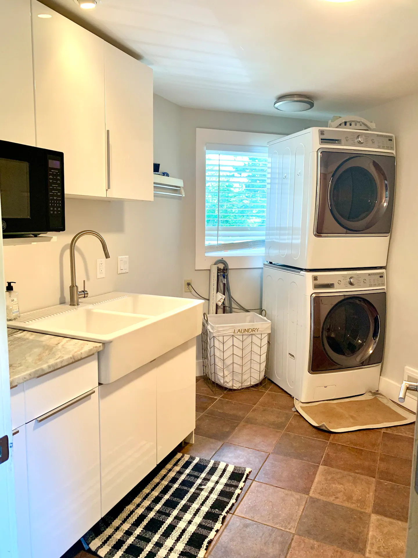 Laundry room with stacked washer and dryer